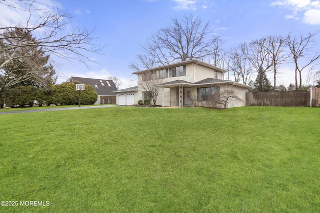 view of front facade featuring a garage and a front lawn