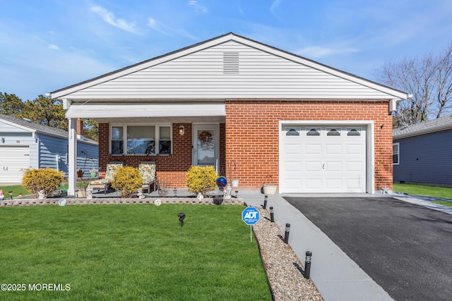 view of front of house featuring a garage, covered porch, and a front lawn