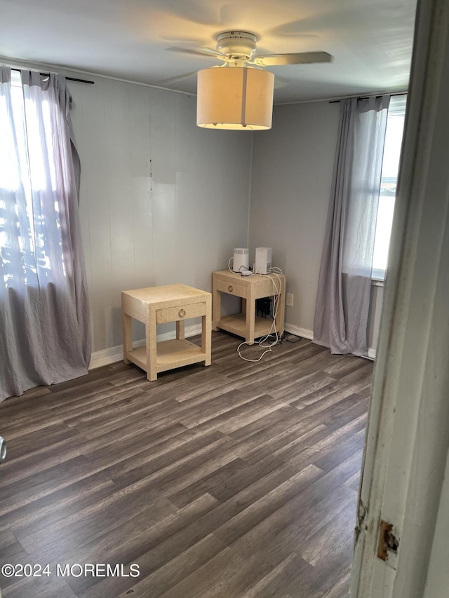 interior space with dark hardwood / wood-style floors and ceiling fan