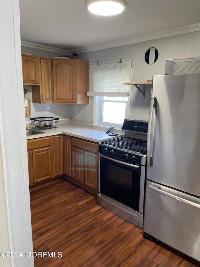 kitchen featuring black gas range oven, dark wood-type flooring, stainless steel fridge, and ornamental molding