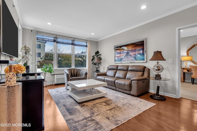 living room featuring crown molding and hardwood / wood-style floors