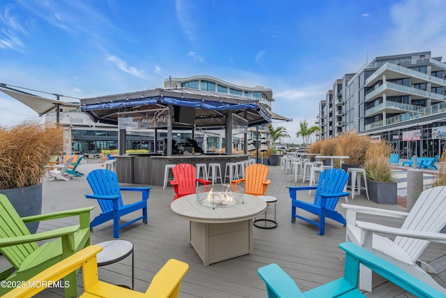 exterior space with exterior bar and a fire pit