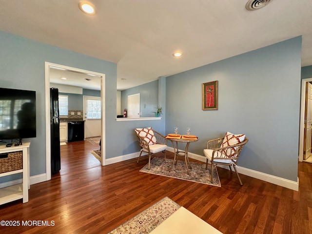 living area featuring dark wood-type flooring