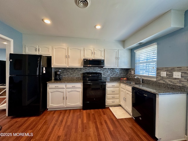 kitchen featuring white cabinetry, sink, dark hardwood / wood-style flooring, and black appliances