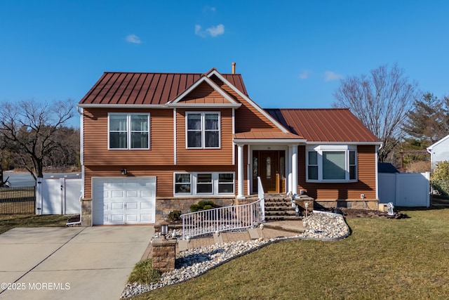 view of front of house with a garage and a front lawn