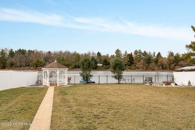 view of yard featuring a water view and a gazebo