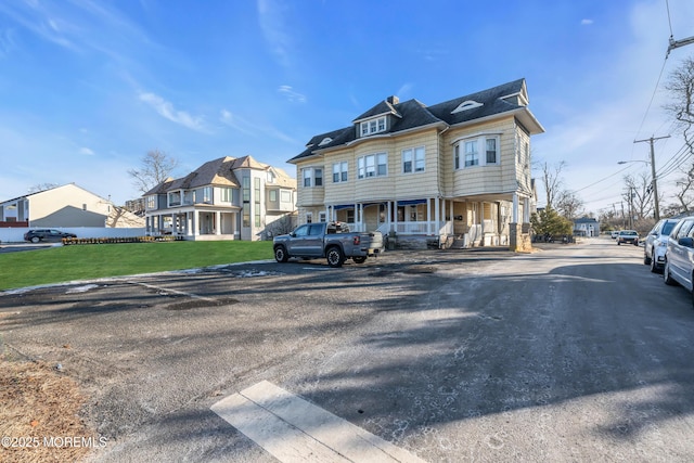 view of front of home with a front lawn and a porch