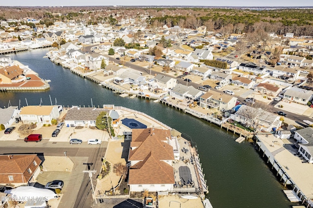 bird's eye view featuring a residential view and a water view