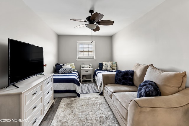 bedroom featuring dark wood-style floors and ceiling fan