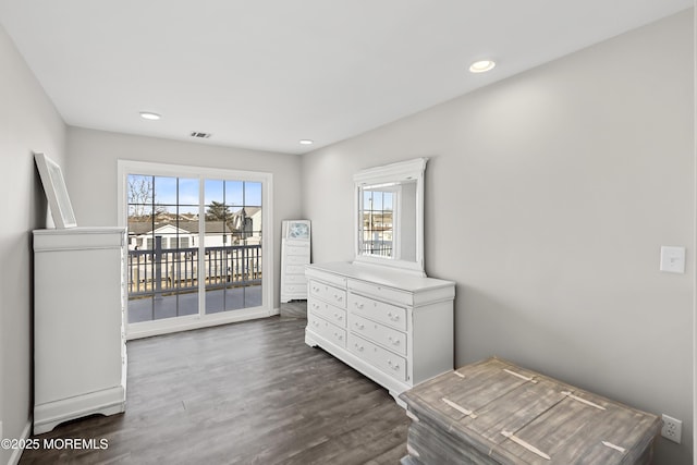 bedroom with access to exterior, recessed lighting, and wood finished floors