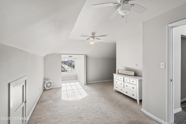 bonus room featuring light carpet, baseboards, lofted ceiling, and a ceiling fan