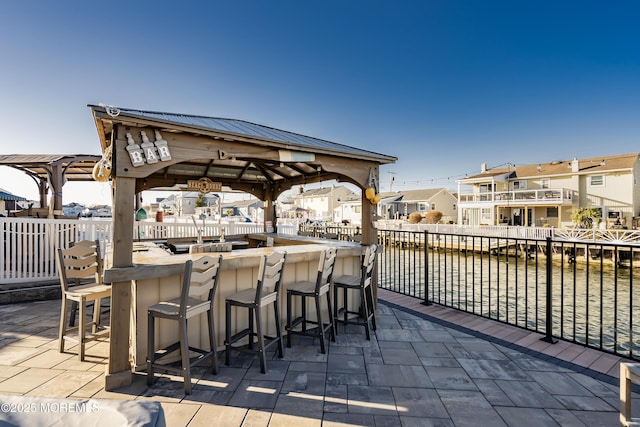 view of patio featuring a gazebo and a residential view