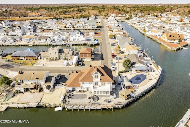 aerial view with a residential view and a water view