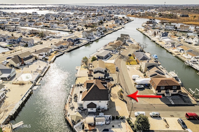 aerial view with a residential view and a water view