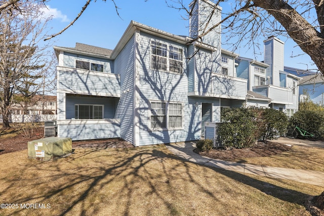 rear view of house with a lawn