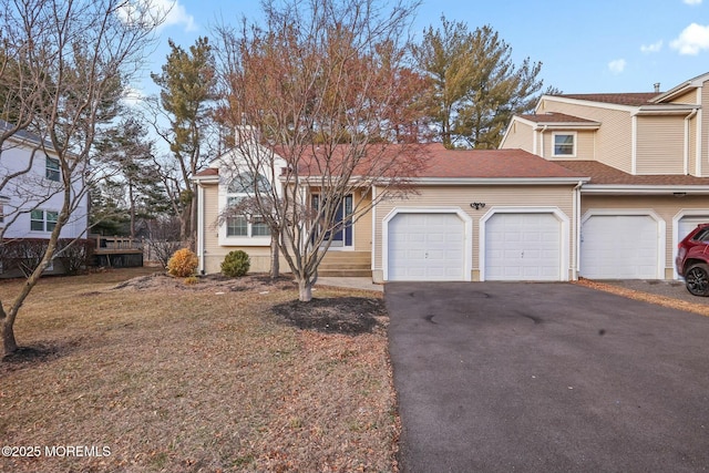 view of front of home with driveway and an attached garage