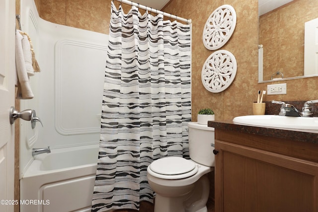 full bathroom featuring toilet, wallpapered walls, and vanity