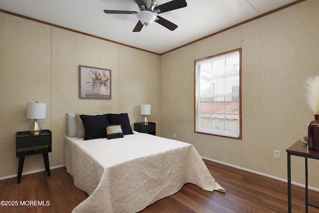 bedroom with ceiling fan, crown molding, baseboards, and wood finished floors