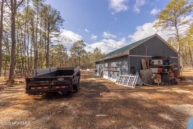 view of side of home with an outbuilding