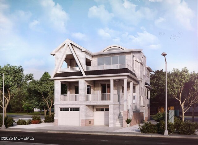 400 Iroquois Ave, Beach Haven, NJ 08008 - greek revival inspired property featuring brick siding, a garage, concrete driveway, and a balcony