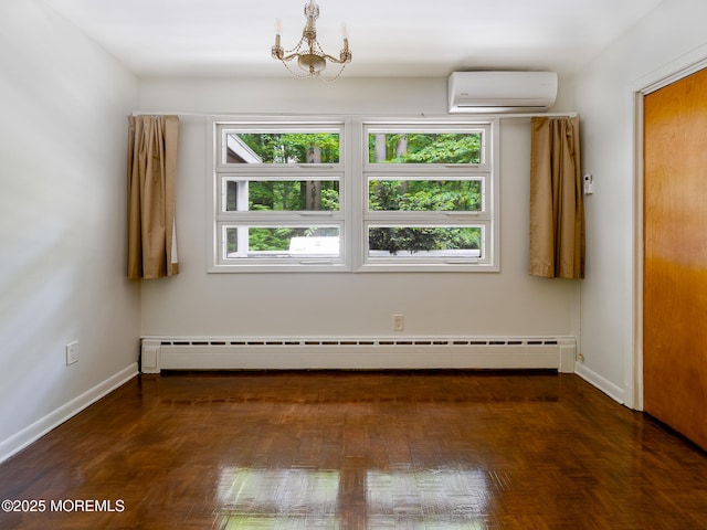 spare room featuring a wall mounted air conditioner, a baseboard radiator, healthy amount of natural light, and baseboards