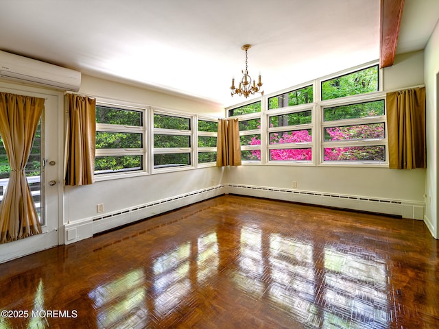 spare room featuring a chandelier, a wall mounted AC, and a baseboard radiator