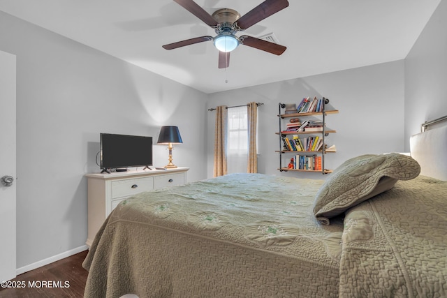 bedroom with hardwood / wood-style flooring and ceiling fan