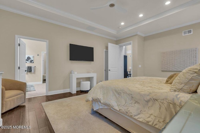 bedroom with hardwood / wood-style floors, baseboards, visible vents, recessed lighting, and ornamental molding