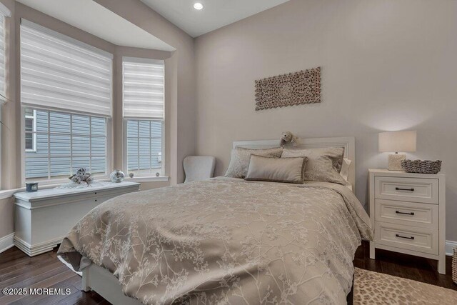 bedroom with recessed lighting, dark wood-style floors, and baseboards