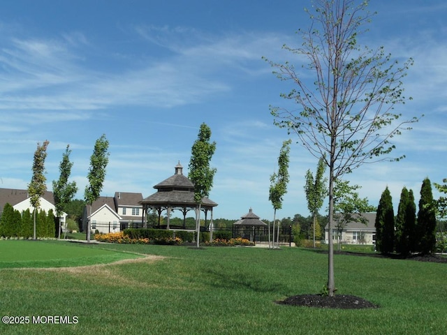 surrounding community featuring a gazebo and a yard