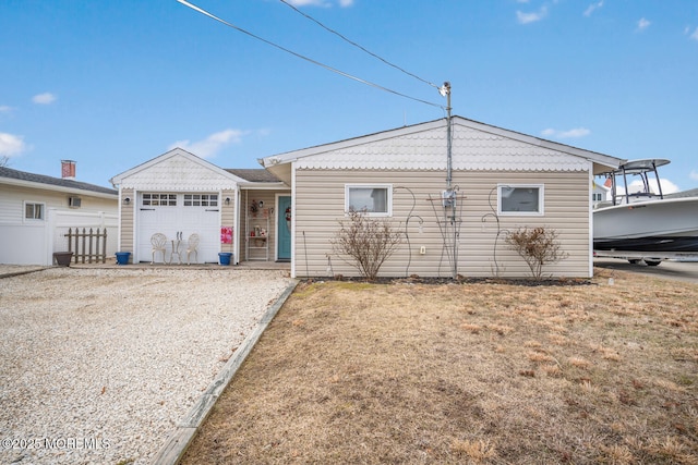 view of front of house featuring a garage and a front yard