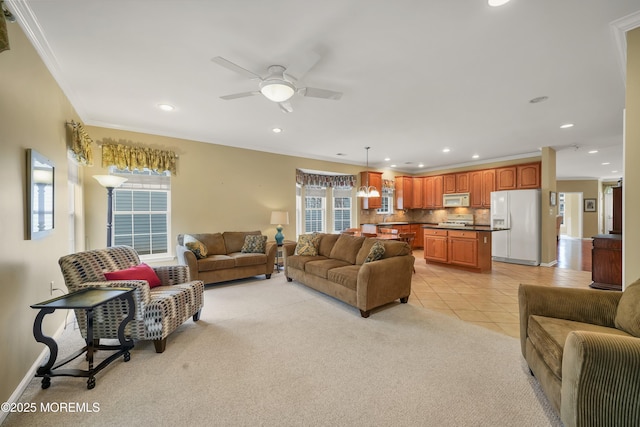 living room featuring crown molding, light colored carpet, and ceiling fan