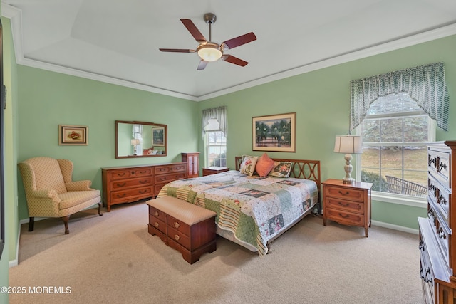 carpeted bedroom with crown molding and ceiling fan