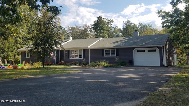 single story home featuring a garage