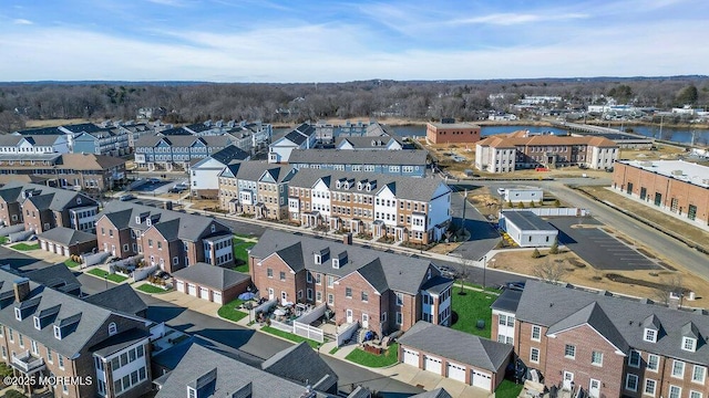 birds eye view of property featuring a residential view and a water view