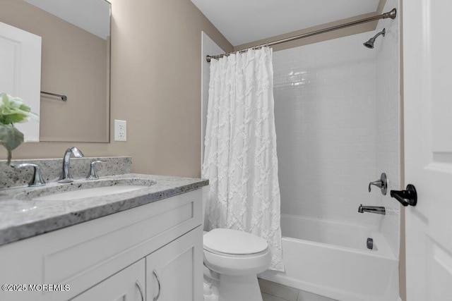 bathroom featuring vanity, shower / bath combination with curtain, and toilet