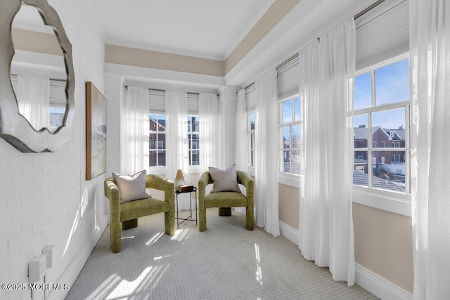 unfurnished room featuring ornamental molding, carpet, and baseboards