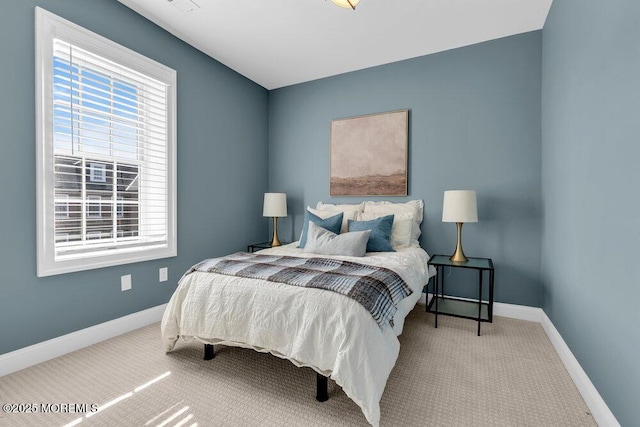 bedroom with carpet floors and baseboards