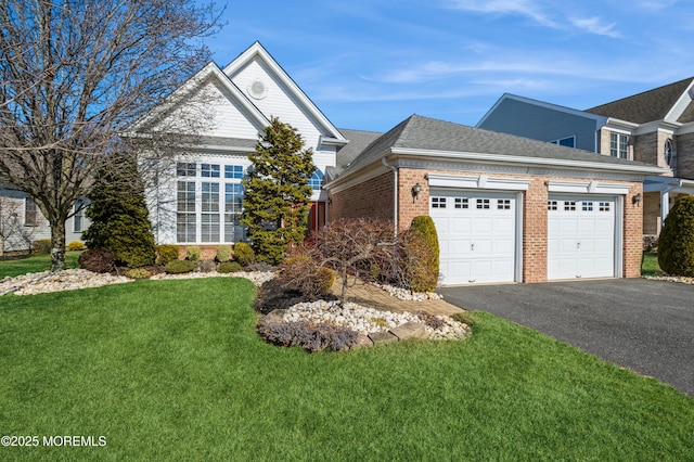 front of property with a garage and a front yard