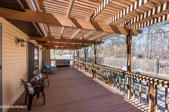 wooden terrace featuring a fenced backyard and a pergola