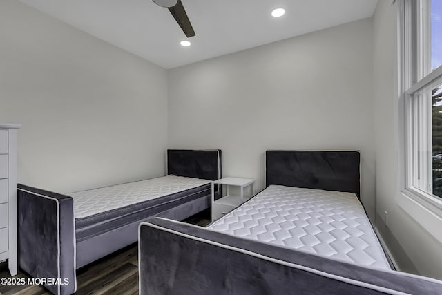 bedroom with ceiling fan and dark hardwood / wood-style flooring