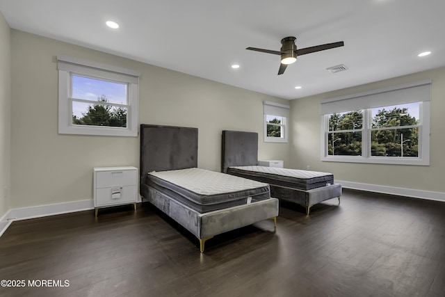 bedroom featuring dark hardwood / wood-style floors and ceiling fan