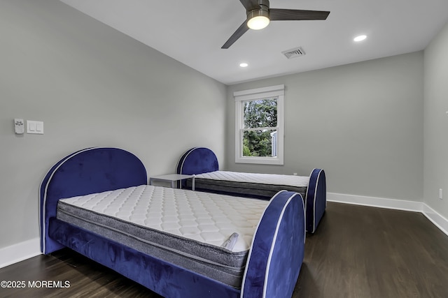 bedroom featuring ceiling fan and dark hardwood / wood-style floors