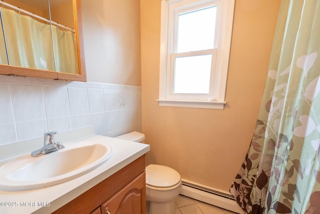 bathroom featuring tile walls, vanity, a baseboard radiator, tile patterned floors, and toilet