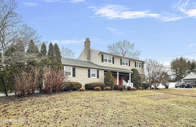 front facade featuring a front lawn