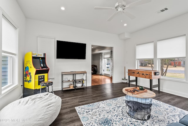 interior space with baseboards, visible vents, a ceiling fan, wood finished floors, and recessed lighting