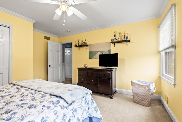 bedroom featuring visible vents, ornamental molding, a ceiling fan, light carpet, and baseboards