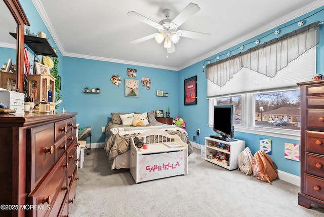 bedroom featuring carpet floors, ornamental molding, a ceiling fan, and baseboards