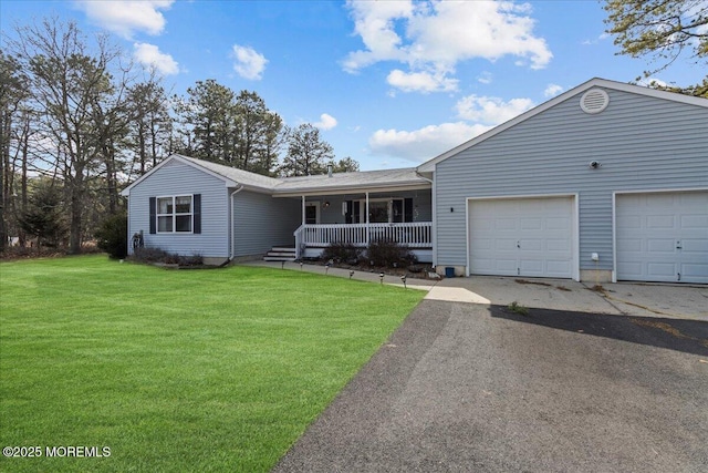 single story home with an attached garage, driveway, a porch, and a front yard