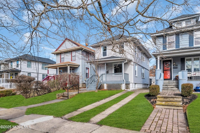 view of front of home featuring covered porch and a front lawn